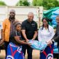 EGENCO officials symbolically making the donation along with the District Commissioner