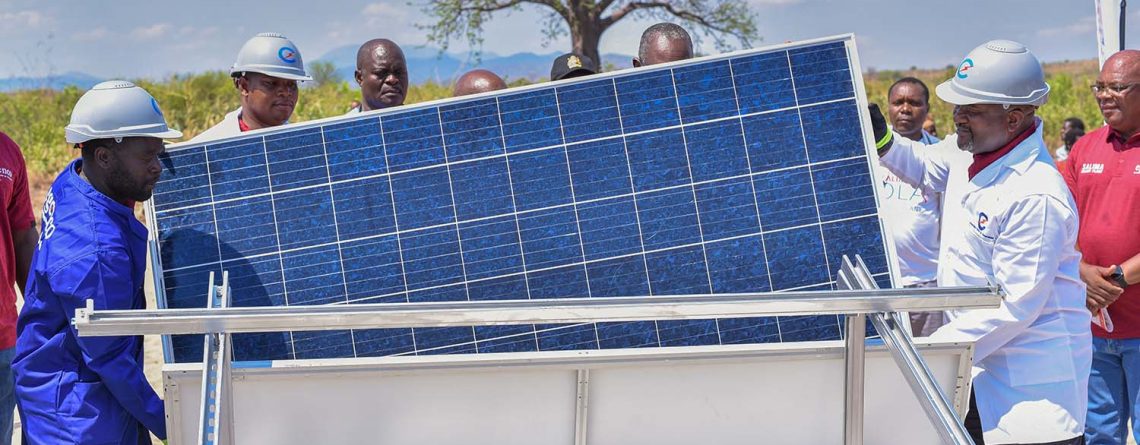 Minister Matola symbolically installs a solar panel