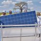 Minister Matola symbolically installs a solar panel